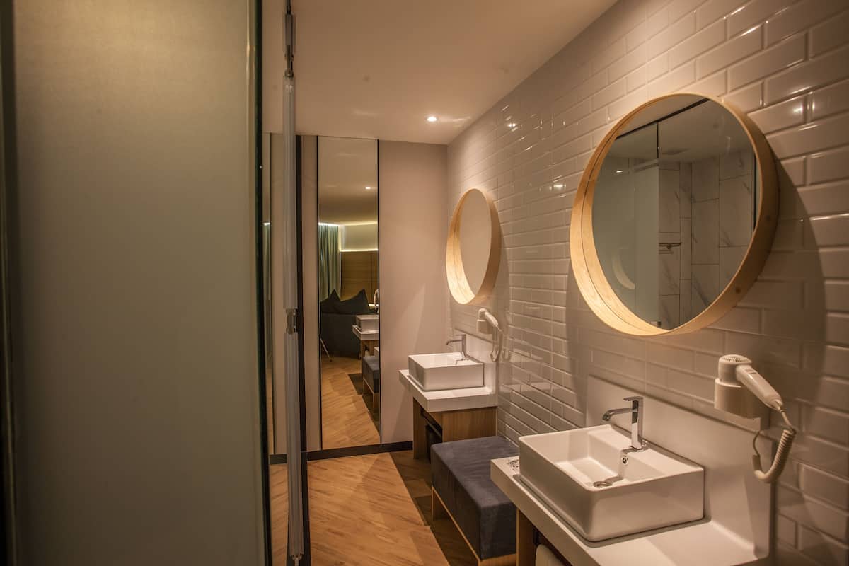 mini suite | bathroom | shower, free toiletries, hair dryer, soap