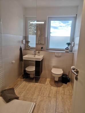 Bathtub, hair dryer, towels, soap
