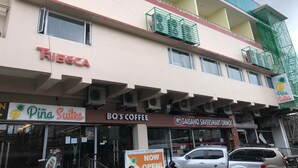 A building with multiple businesses including 'Ribecca', 'Pina Suites', 'BO'S COFFEE', and 'Gaisano Saversmart Ormoc'. - Piña Suites (Ormoc)