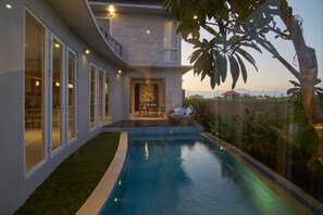 A modern house with a swimming pool, large windows, and a balcony. - The Araya Villas Cemagi Beach (Cemagi)