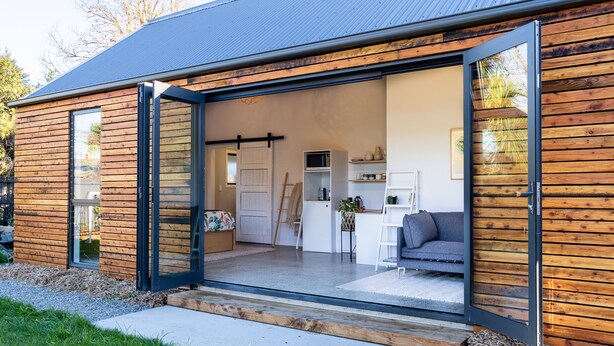 A modern house with a large open-plan living area, a kitchen, and a dining space. - Roker Street Retreat - Contemporary Kiwi Styled Studio (Christchurch)