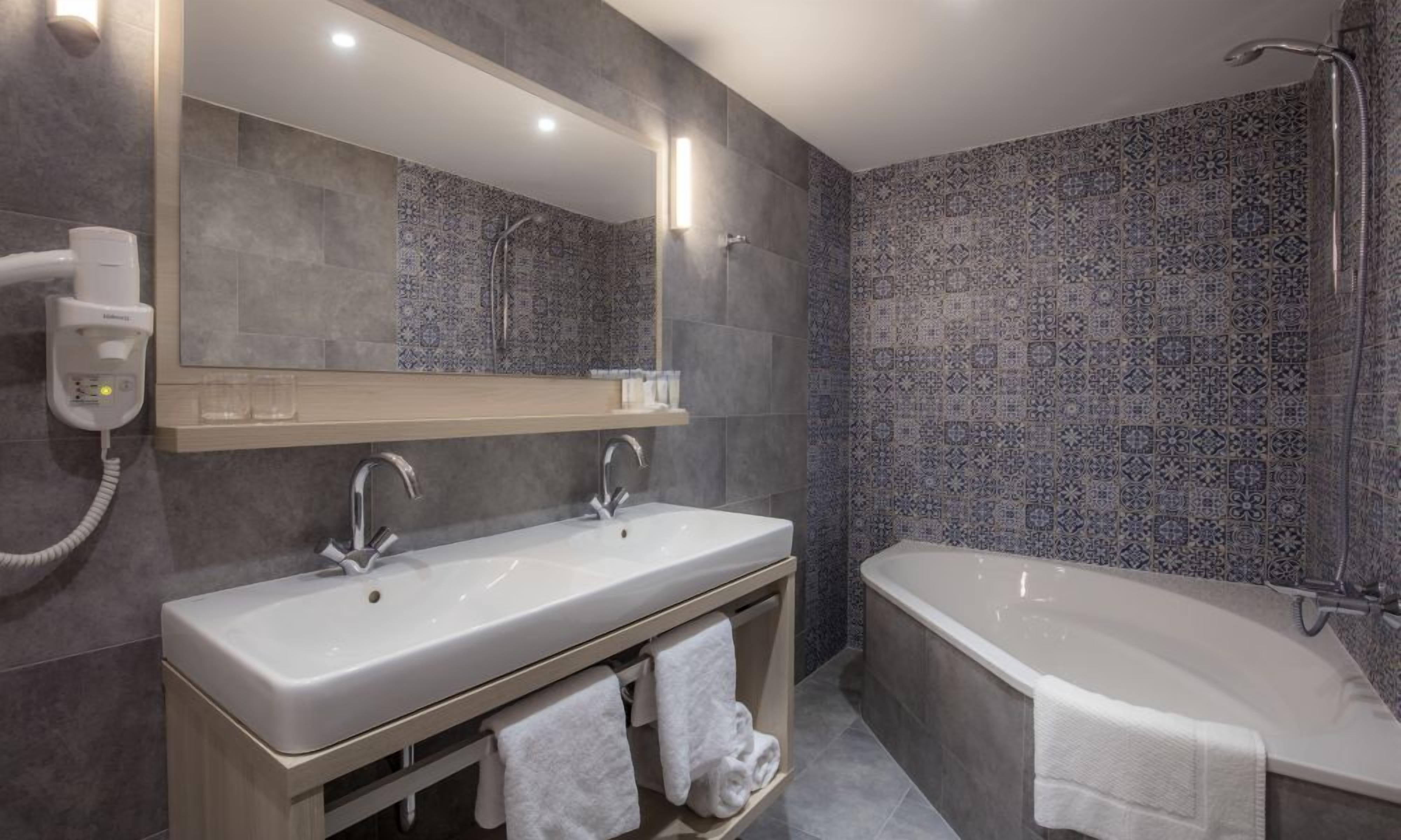 hair dryer, towels, soap, toilet paper