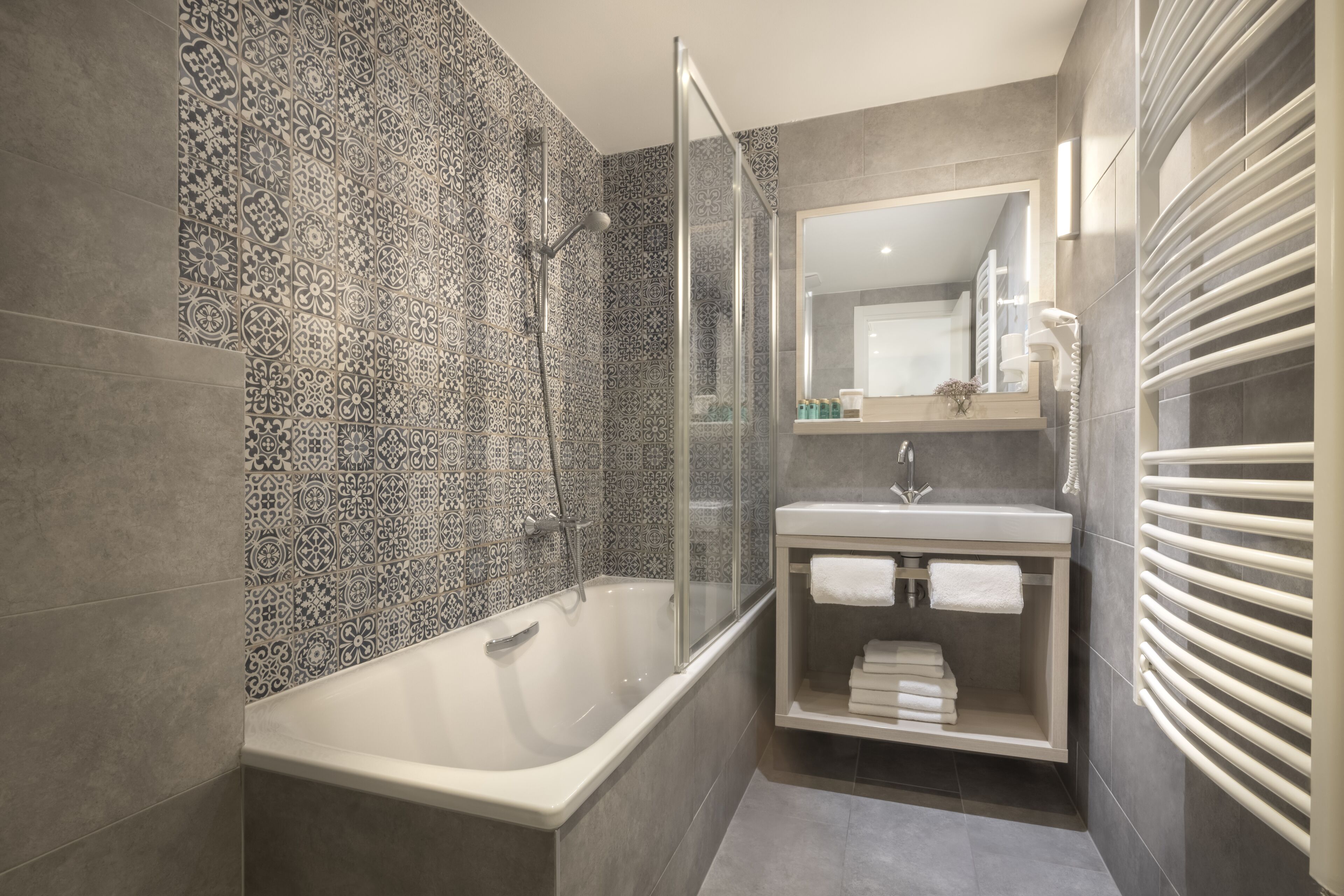 hair dryer, towels, soap, toilet paper