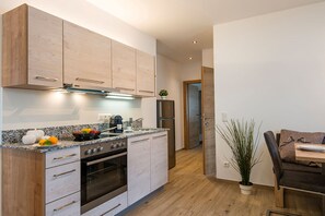 Fridge, microwave, stovetop, coffee/tea maker