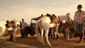 A group of people with horses and a vehicle in a desert setting. - King’s Abode - Luxuria Ranakpur by Moustache (Desuri)