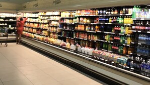 A refrigerated section of a grocery store with a variety of chilled juices and beverages. - Avisa Stays. A hidden gem. Luxury beach living.  (Ocho Rios)