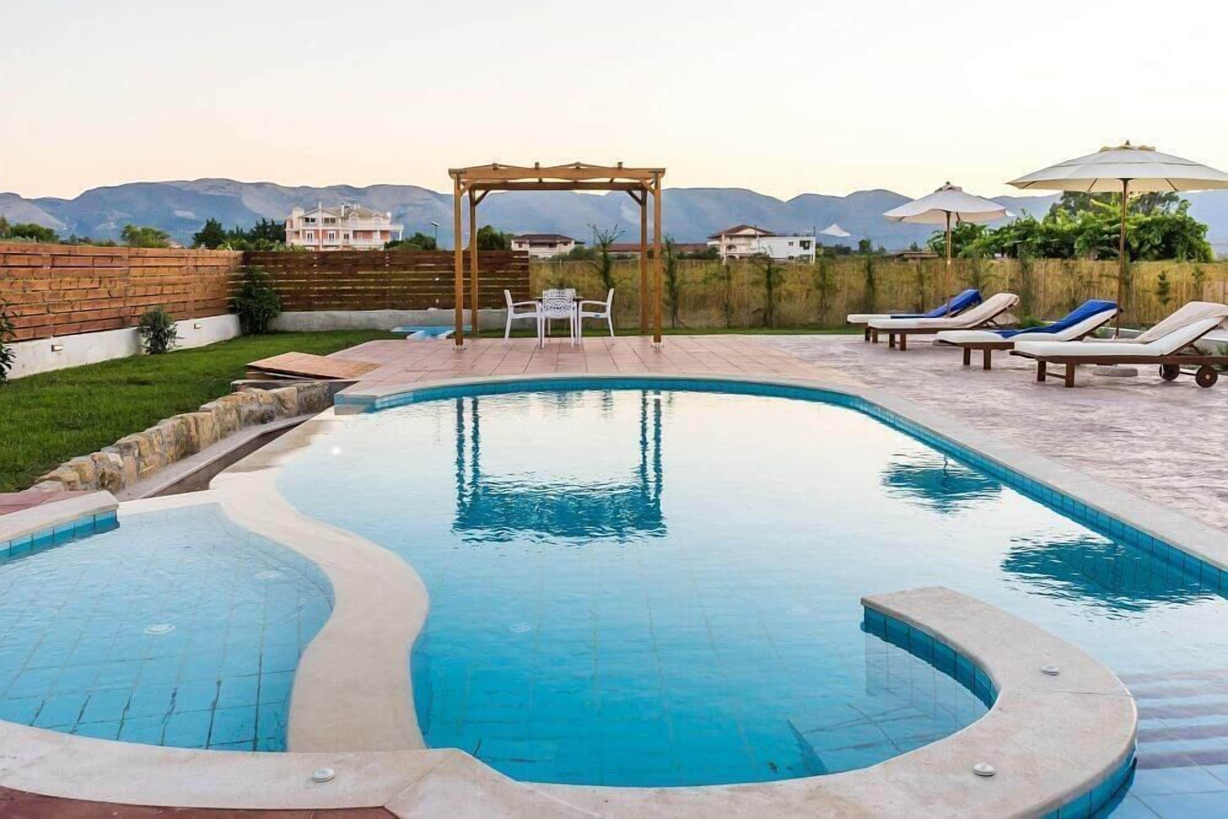Seasonal outdoor pool, pool umbrellas, pool loungers