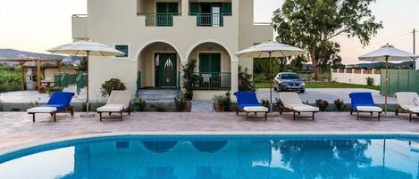 Seasonal outdoor pool, pool umbrellas, sun loungers