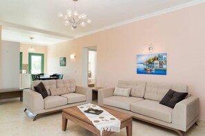 Family Villa, Private Pool | Living room | Flat-screen TV
