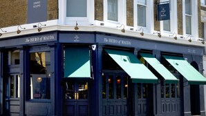 A building with a sign reading "The Hero of Maida" and "Public House Dining Rooms." - The Hero of Maida (London)