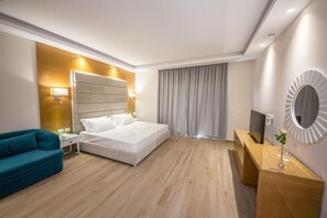 Deluxe Triple Room, Balcony, Ground Floor | 1 bedroom, minibar, in-room safe, desk