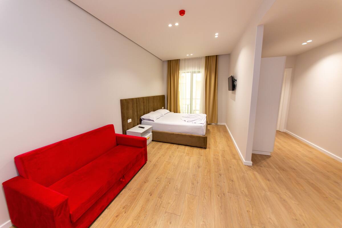 Family Room, Balcony, Partial Sea View | Minibar, in-room safe, desk, blackout curtains