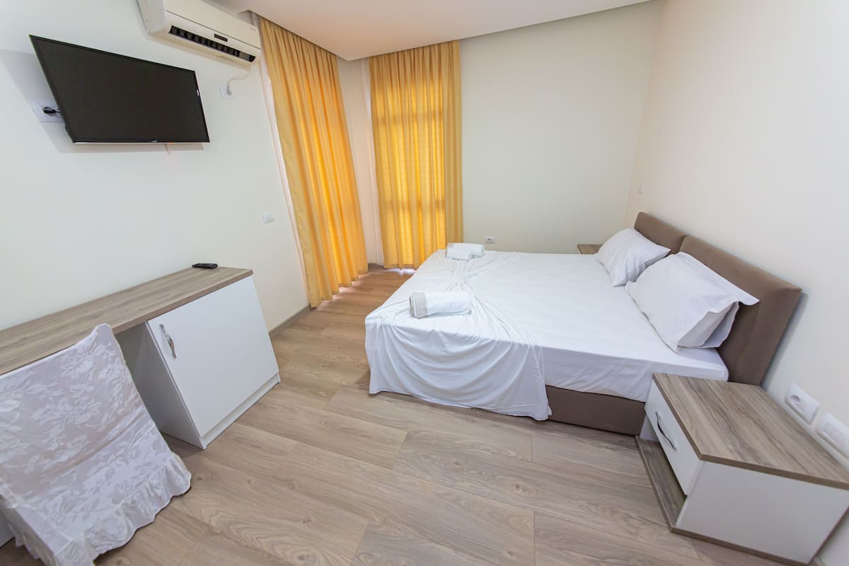 Desk, laptop workspace, free WiFi, bed sheets