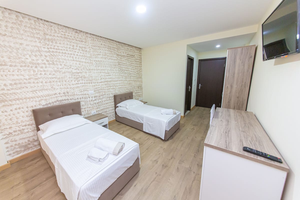 Desk, laptop workspace, free WiFi, bed sheets