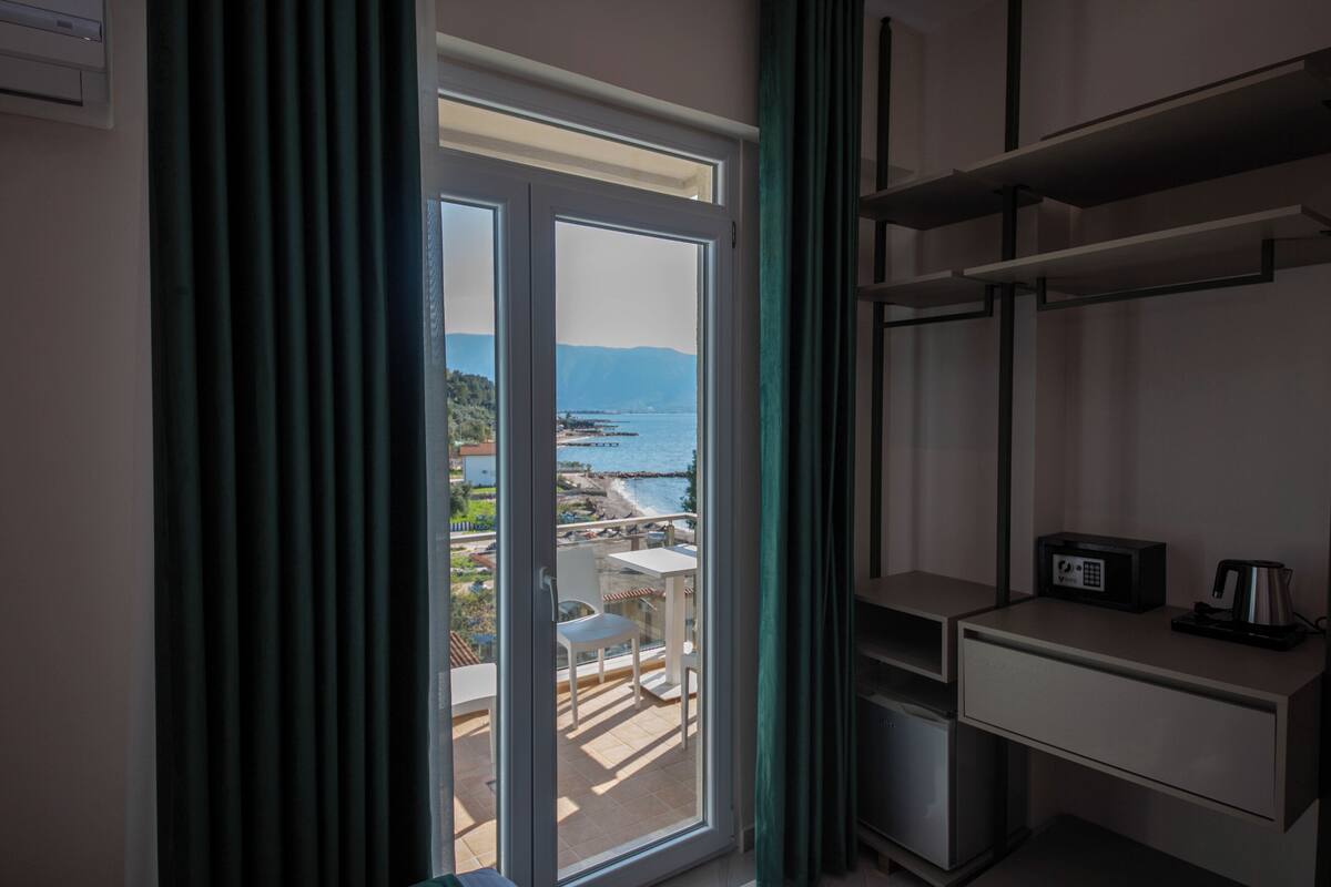 Double Room, Balcony, Partial Sea View | In-room safe, desk, blackout drapes, soundproofing