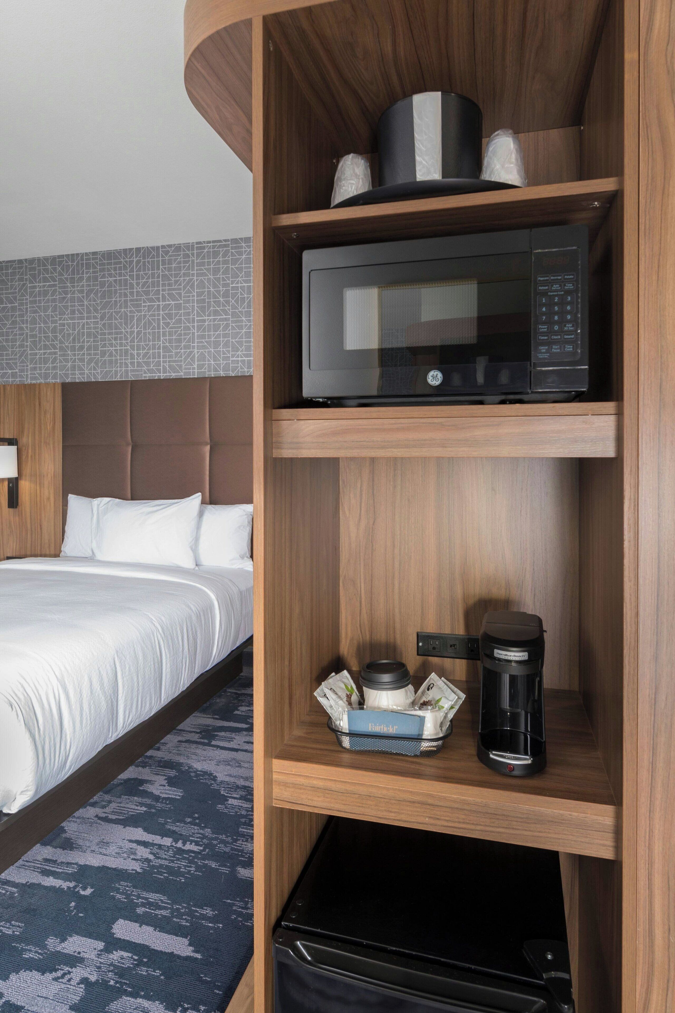 pillow-top beds, desk, laptop workspace, blackout curtains