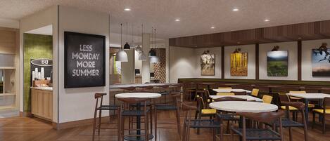 A modern restaurant interior with wooden flooring, round tables, and chairs.