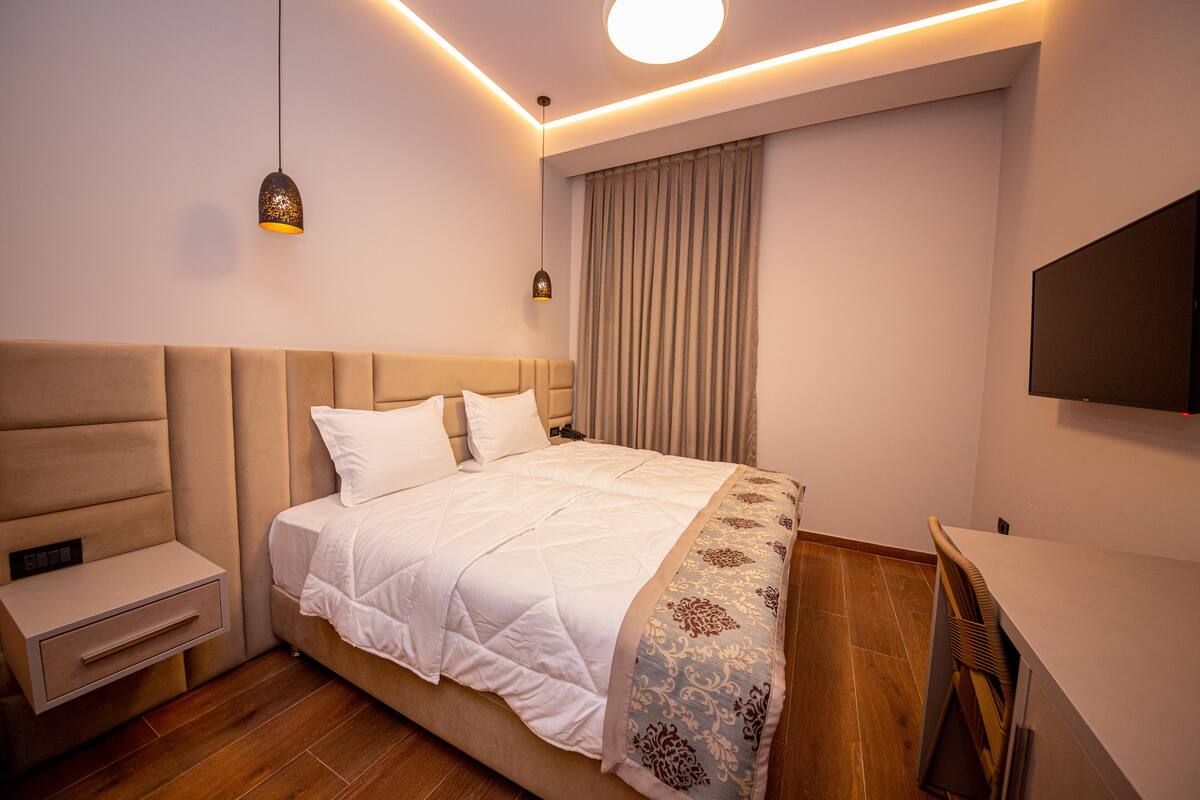 Double Room, Ground Floor | Minibar, in-room safe, desk, WiFi (free)