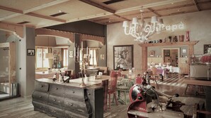 A spacious kitchen with a large island, wooden cabinets, and a vintage coffee machine.