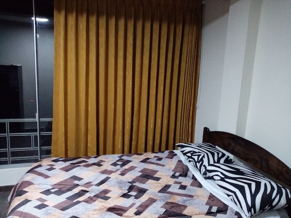 Blackout curtains, iron/ironing board, free WiFi, bed sheets