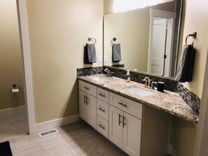 Combined shower/bathtub, hair dryer, towels, soap