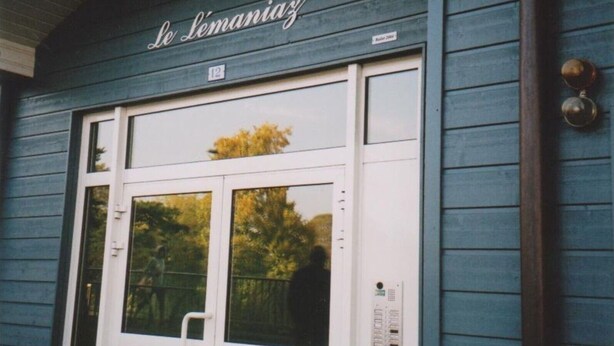 A building with a sign reading "Le Lémaniaz" and a number "12" above the entrance.