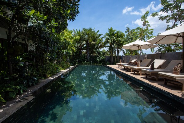 Outdoor pool, open 6:00 AM to 10:00 PM, pool umbrellas