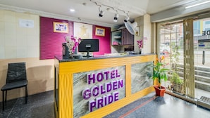 A reception desk with a sign reading "HOTEL GOLDEN PRIDE". - OYO 29087 Hotel Golden Pride (Hyderabad)