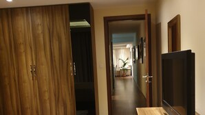 A bedroom with a bed, a TV, and a wardrobe. - 2 double  Bedrooms  2 Bath Apartment With A/C Bugibba close to the sea  (St Paul's Bay)