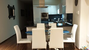 A modern kitchen with white cabinets, a built-in oven, and a microwave. - 2 double  Bedrooms  2 Bath Apartment With A/C Bugibba close to the sea  (St Paul's Bay)