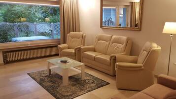 Comfort Apartment, Kitchen, Garden View | Living room | Flat-screen TV