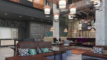 Ein stilvoller Lounge-Bereich mit Sitzgelegenheiten, einer Speisekarte und hängenden Pendelleuchten.