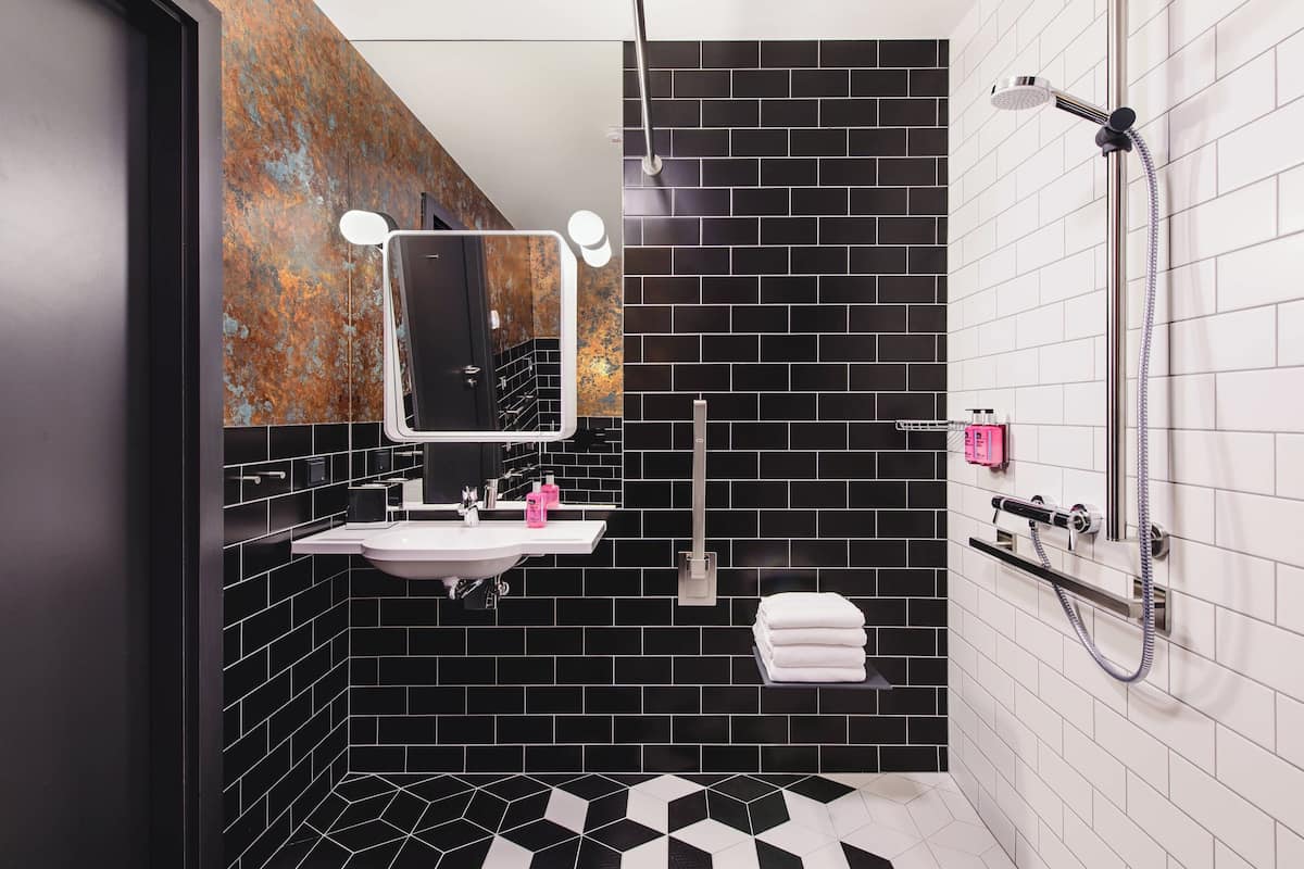 shower, designer toiletries, hair dryer, towels