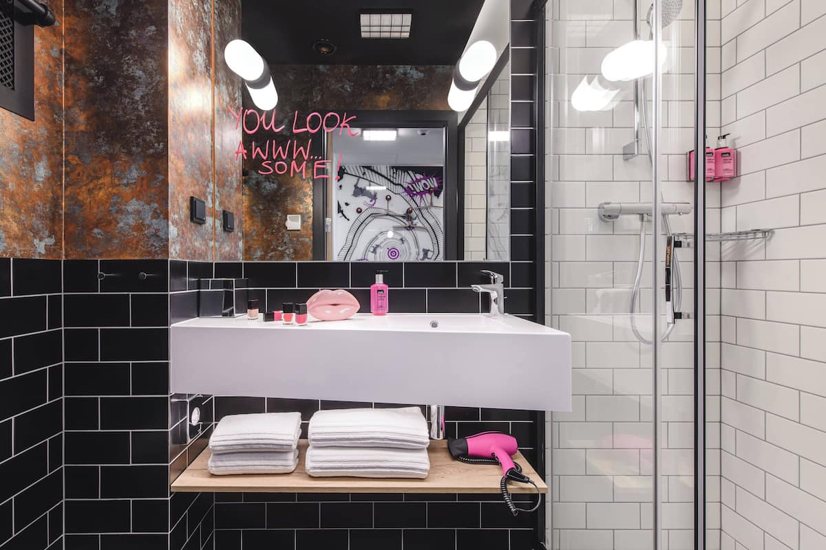 shower, designer toiletries, hair dryer, towels