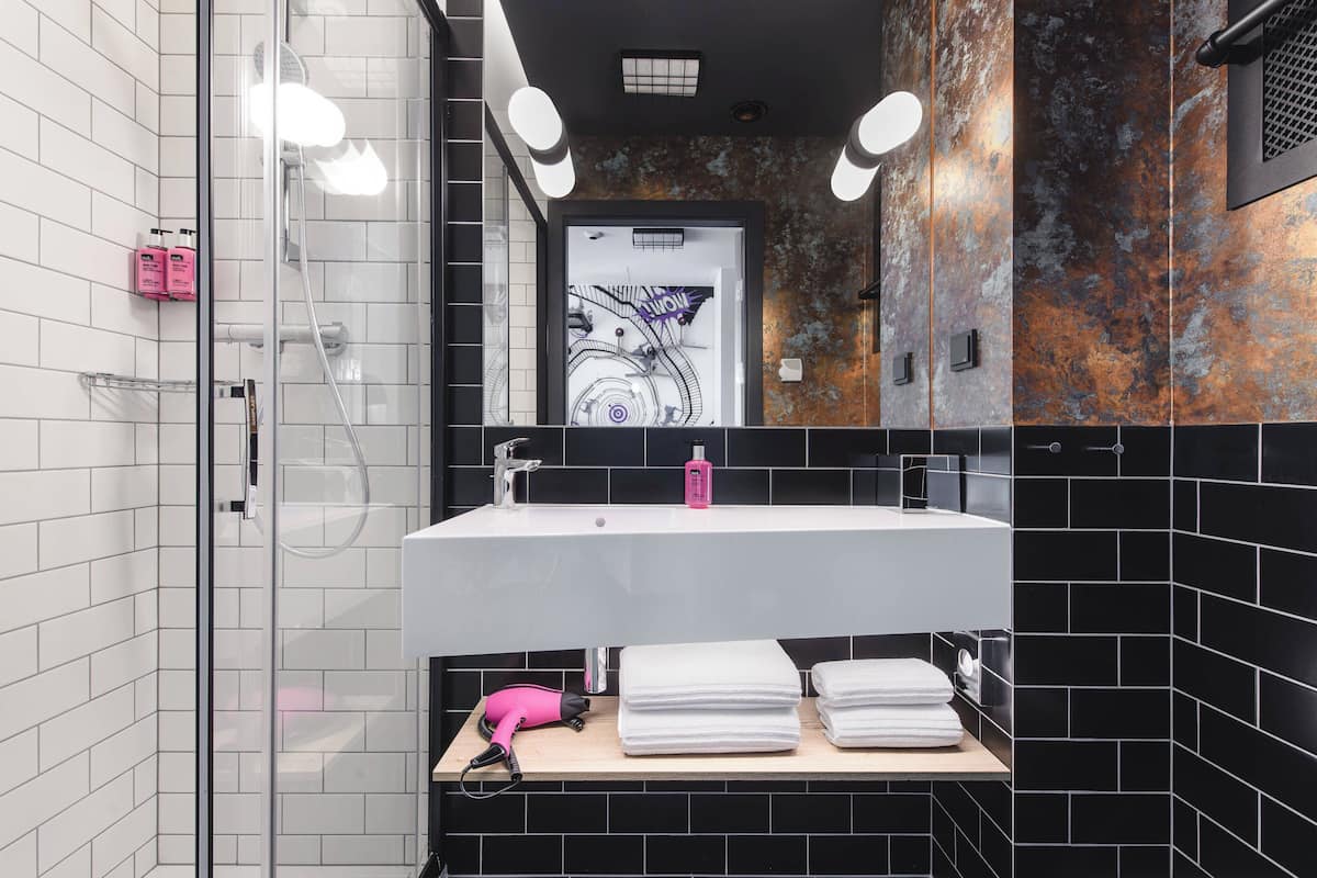 shower, designer toiletries, hair dryer, towels