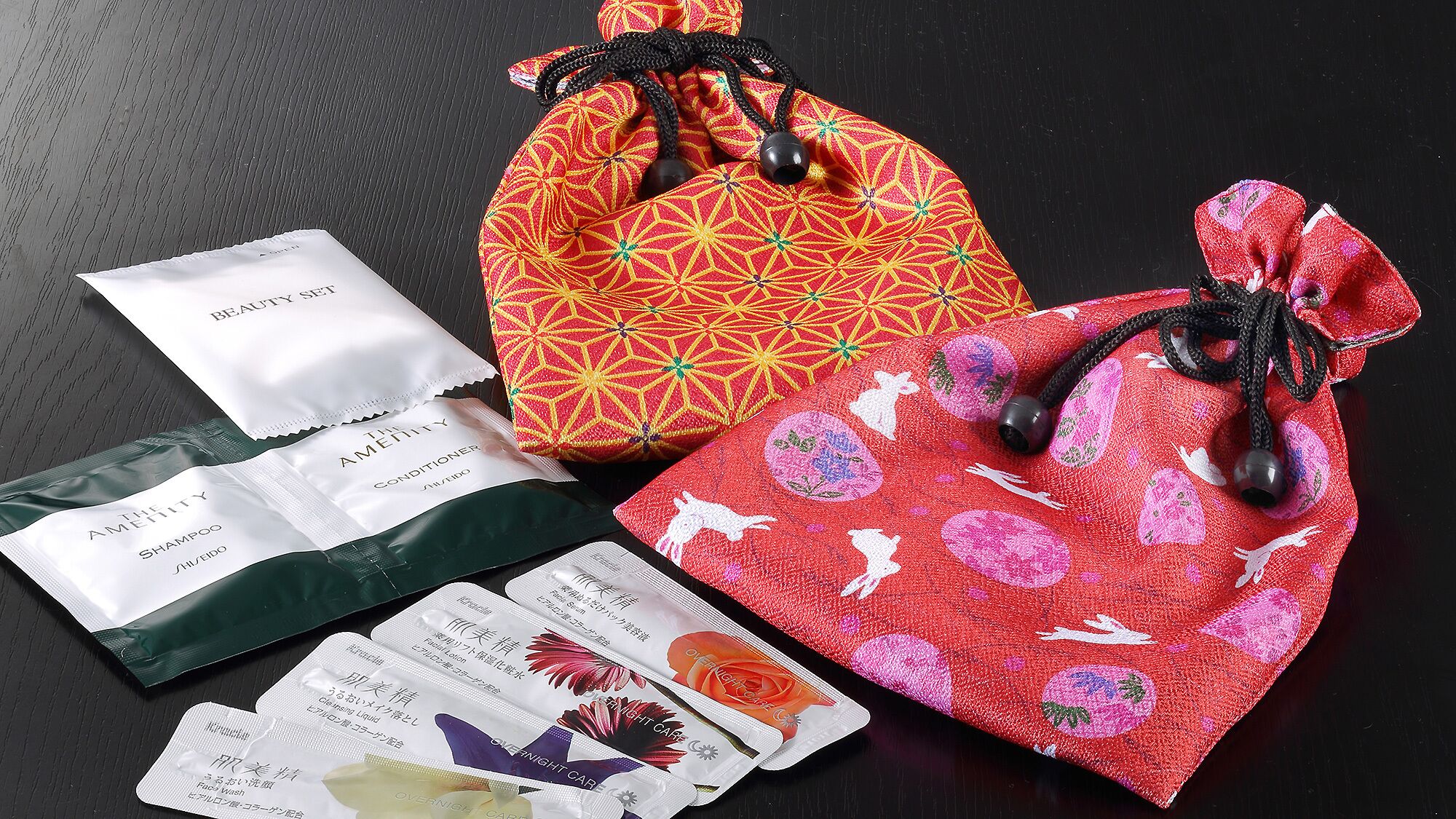 A set of gift bags and toiletries.