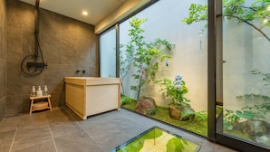 A modern bathroom with a large window, a glass floor, and a wooden vanity. - Tabitabi Stay Shinsen (Kyoto)