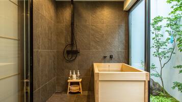 Separate tub and shower, free toiletries, hair dryer, slippers
