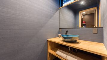 Separate bathtub and shower, free toiletries, hair dryer, slippers