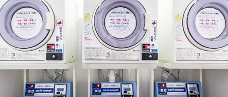 Three rows of identical machines with labels in a foreign language, likely indicating a specialized facility or equipment.