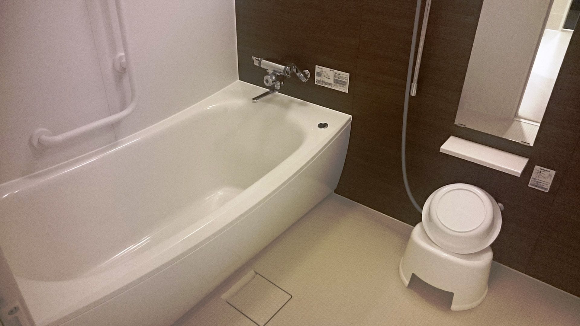 separate bathtub and shower, hair dryer, slippers, electronic bidet