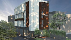 A modern building with a flat roof, large windows, and a sign that reads "Dau." - Daun Residence Bandung (Bandung)