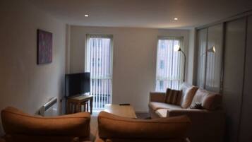 Apartment, 1 Bedroom | Living area | Flat-screen TV