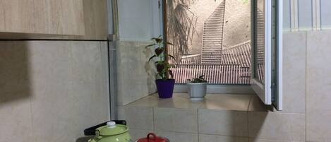 Fridge, coffee/tea maker, electric kettle, cookware/dishes/utensils