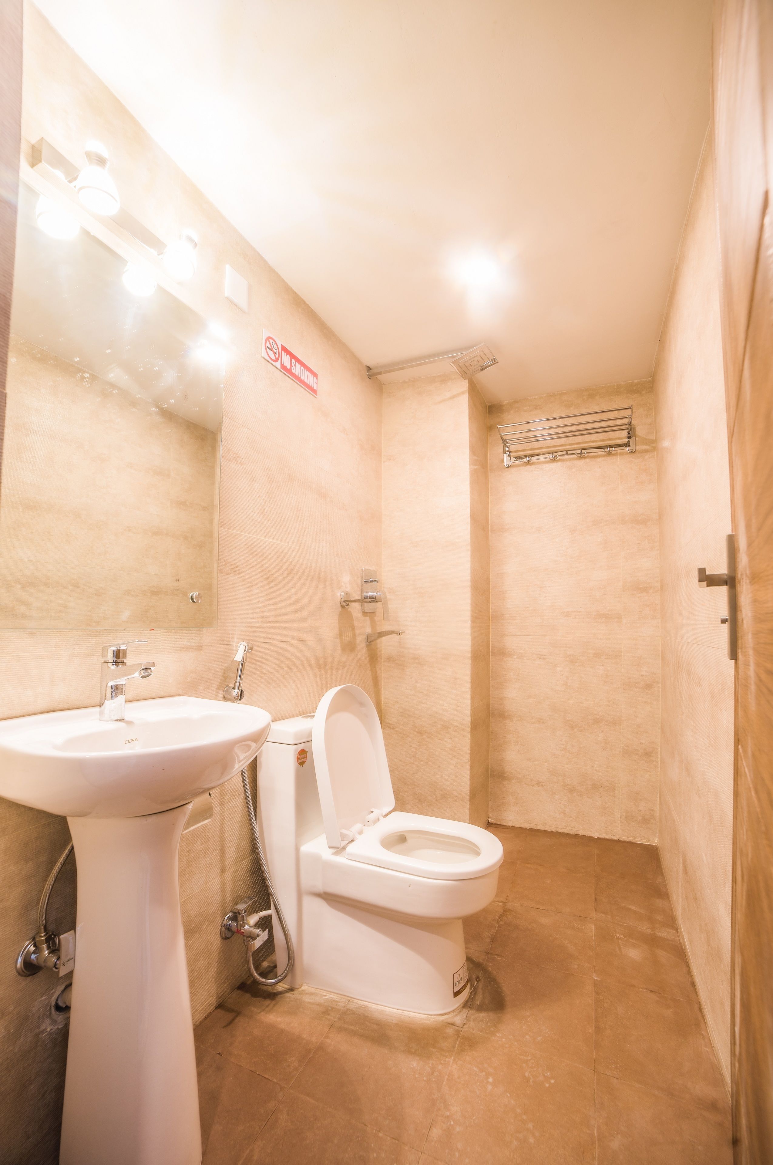 deluxe room | bathroom | shower, rainfall showerhead, free toiletries, slippers