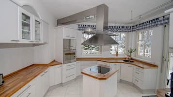 Villa | Private kitchen | Fridge, microwave, oven, stovetop