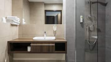 Shower, designer toiletries, hair dryer, towels