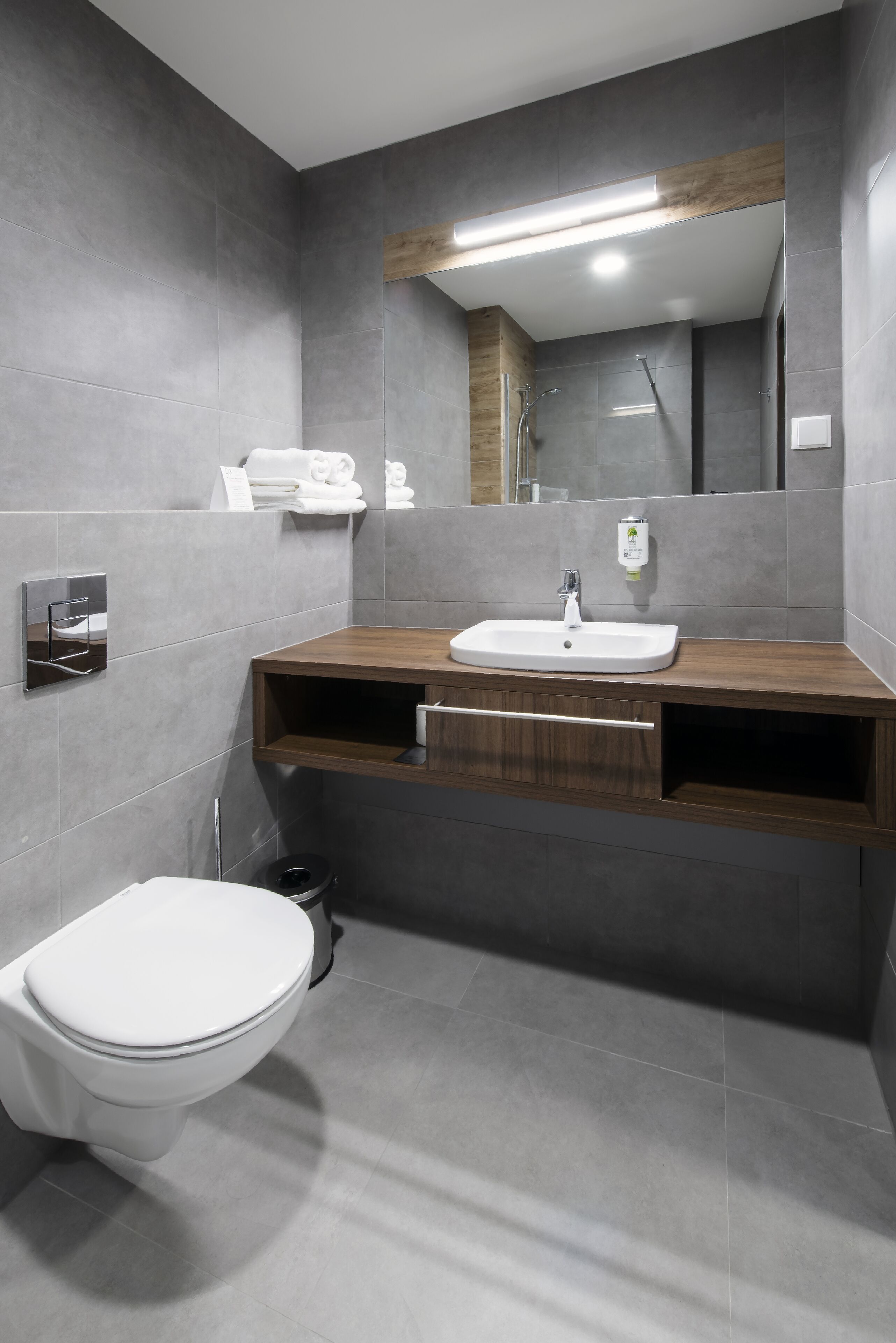 shower, designer toiletries, hair dryer, towels