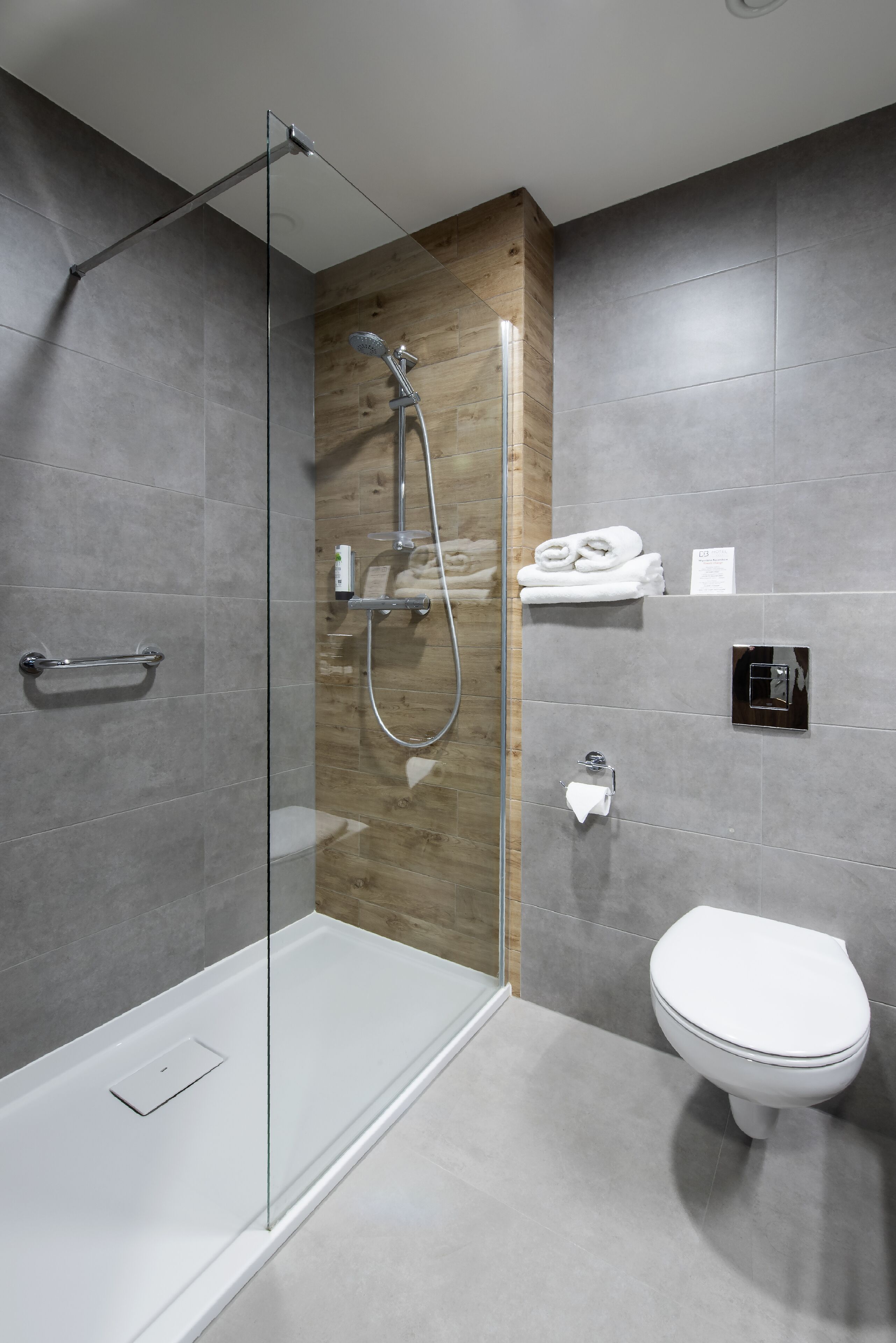 shower, designer toiletries, hair dryer, towels