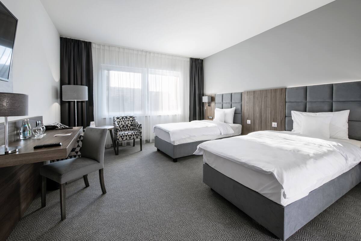 Twin Room, Accessible | Minibar, desk, laptop workspace, blackout drapes